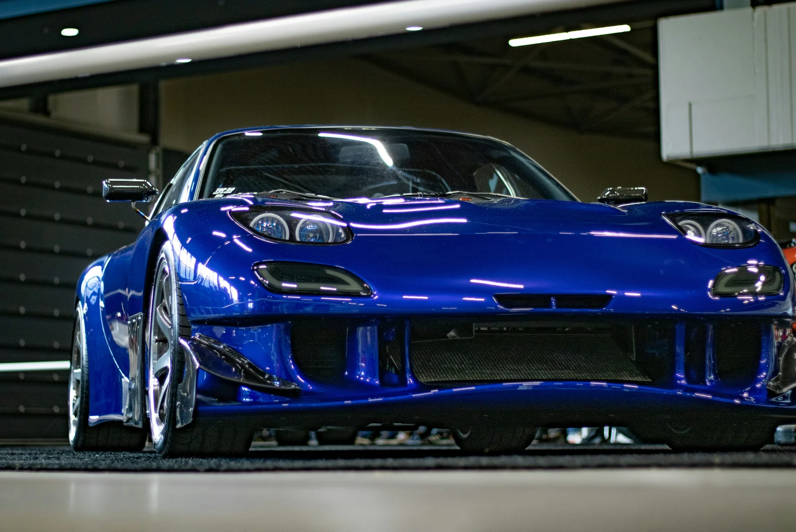 Blue Mazda RX-7 catching reflected garage lighting, photograph supplied by the owner